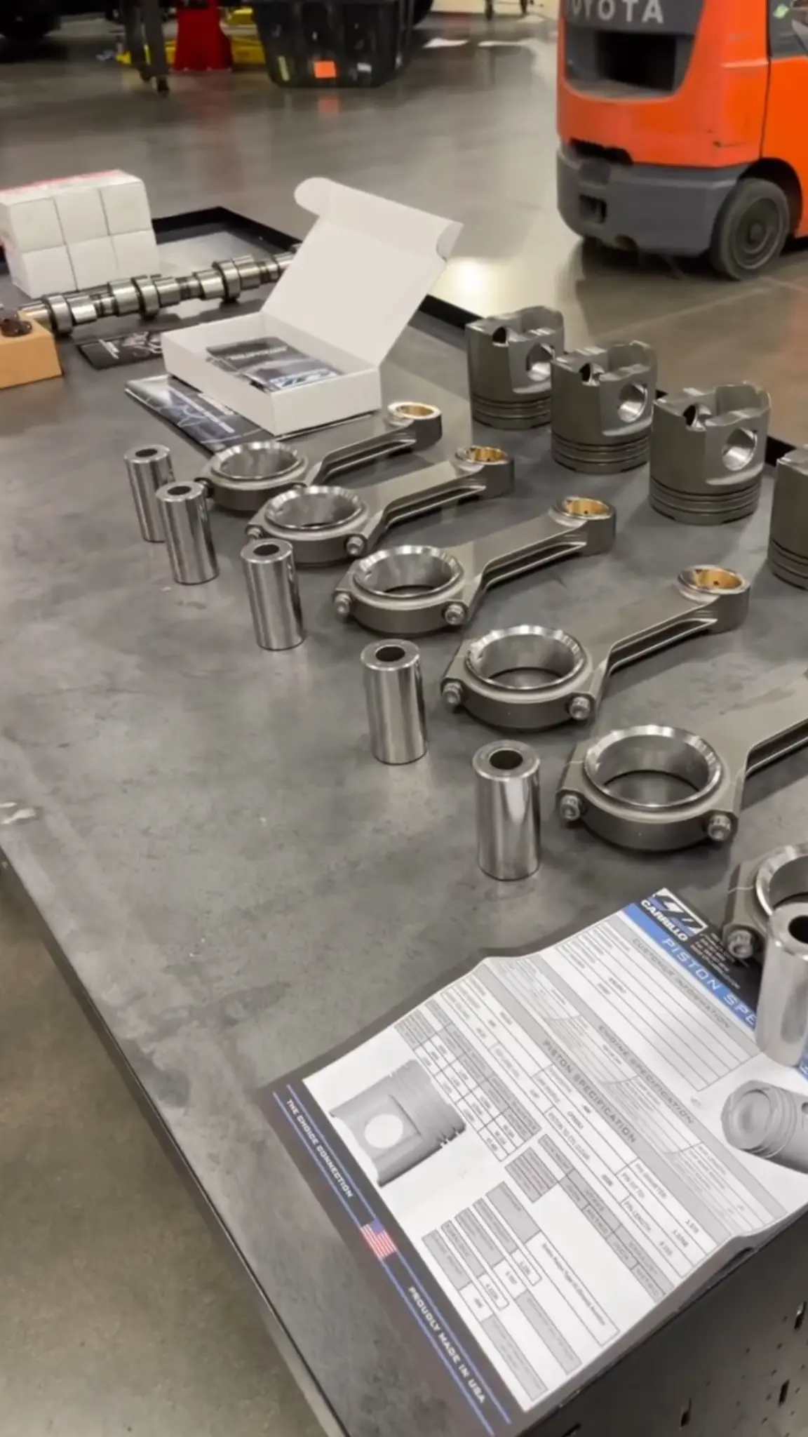 Forged pistons and connecting rods arranged for a diesel build