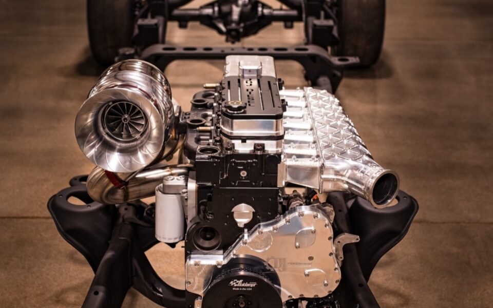 Custom diesel engine and turbo assembly on a chassis in the JBJ Diesel shop